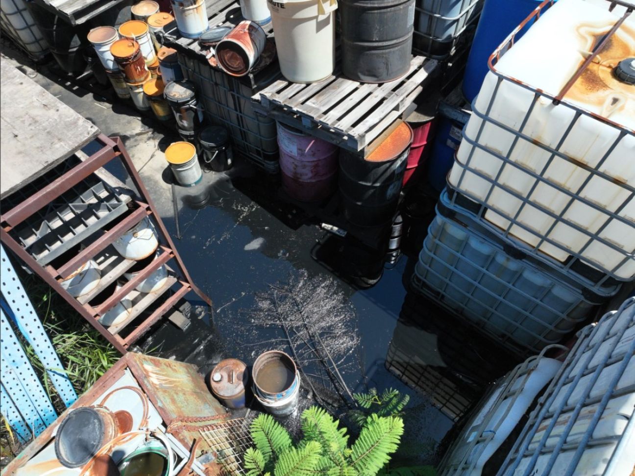 On site, amid the improperly stored hazardous chemical containers